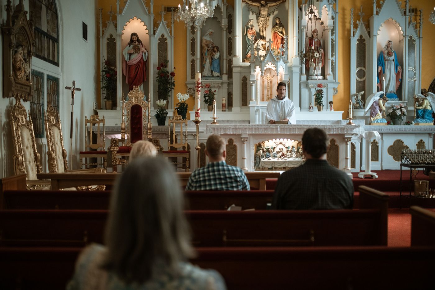 People seated in a church during a service.